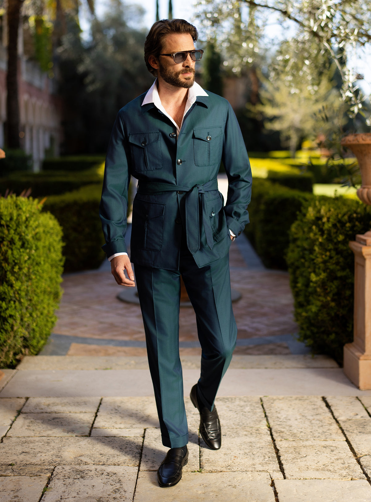Teal Consiglieri ensemble with a belted patch-pocket jacket and matching trousers