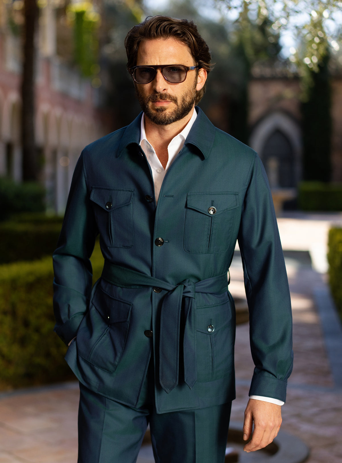 Teal Consiglieri ensemble with a belted patch-pocket jacket and matching trousers