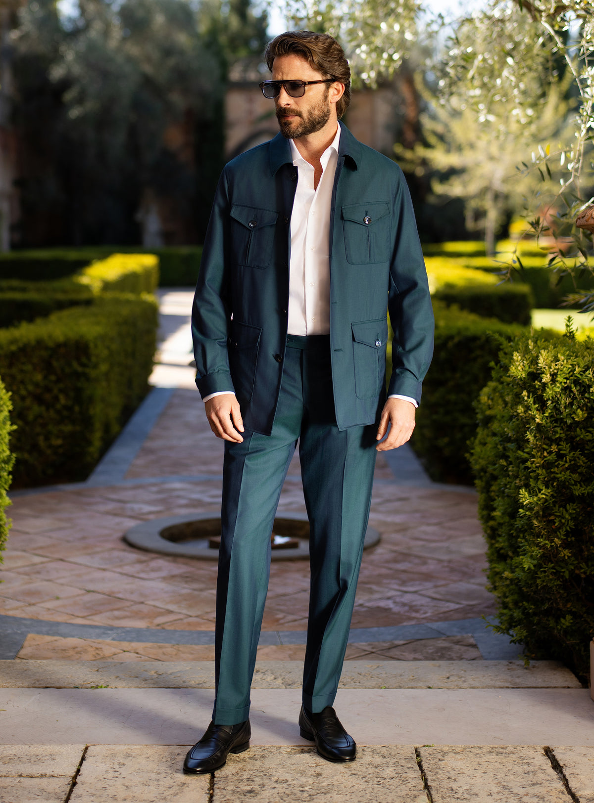 Teal Consiglieri ensemble with a belted patch-pocket jacket and matching trousers