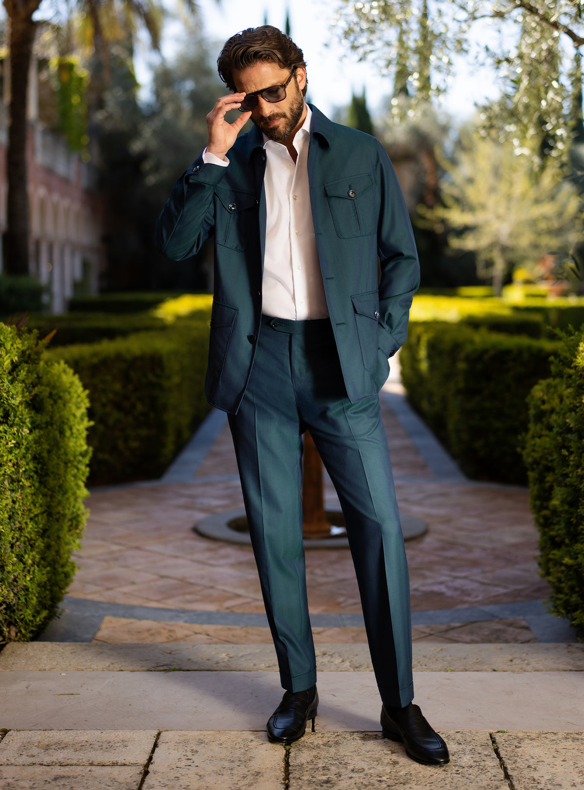 Teal Consiglieri ensemble with a belted patch-pocket jacket and matching trousers