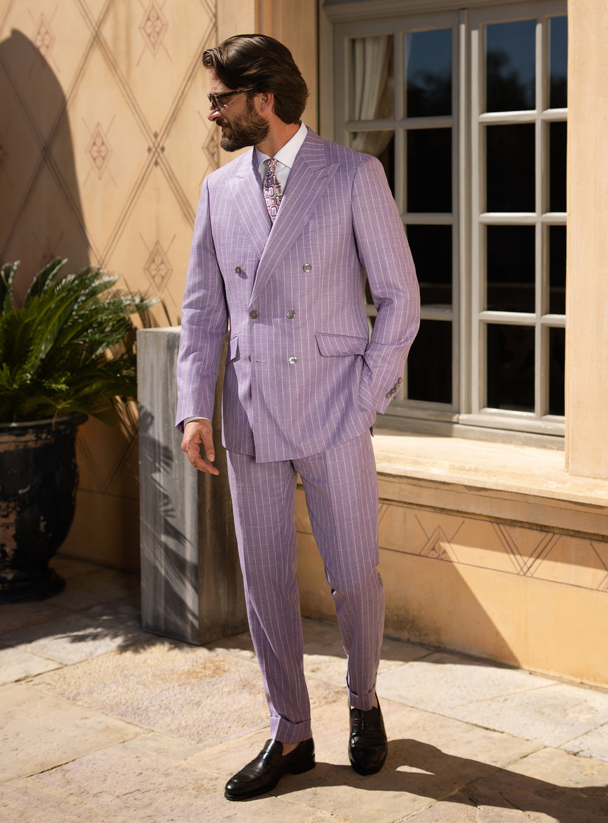 Lilac double-breasted Consiglieri suit worn with a white shirt