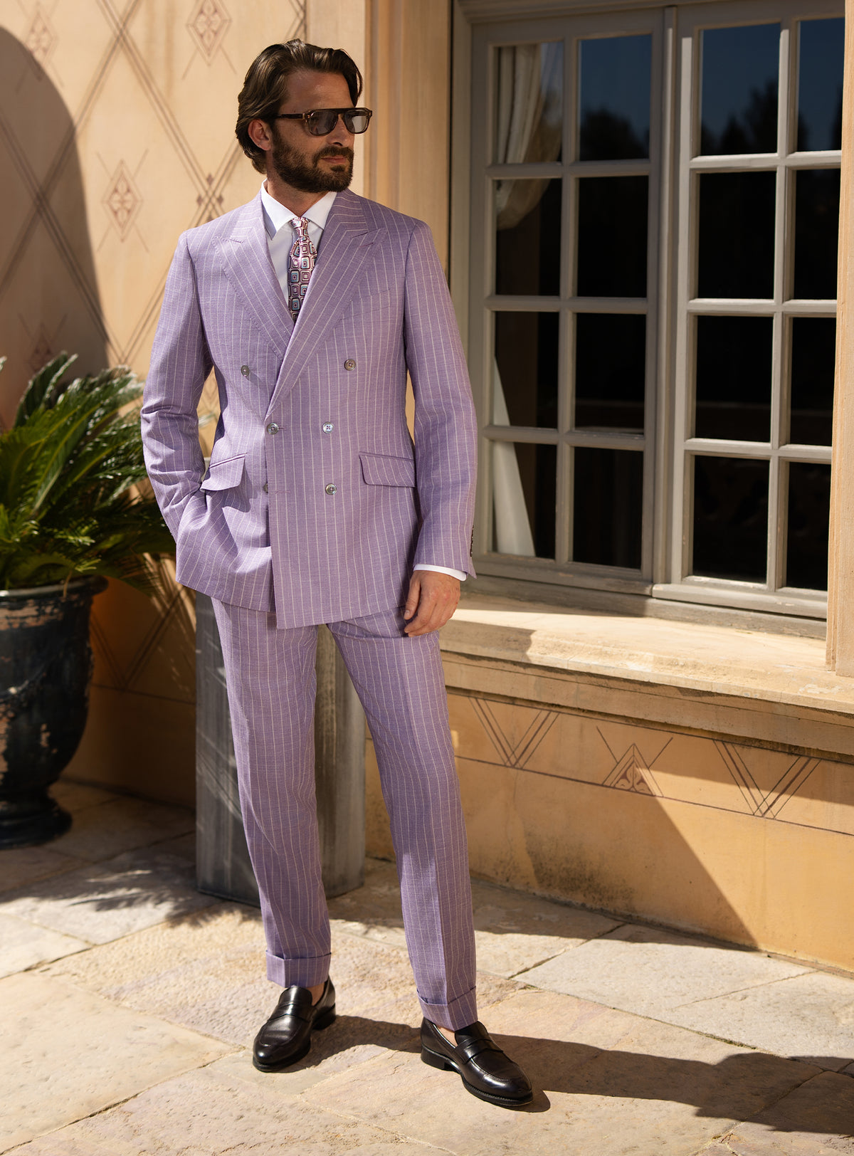 Lilac double-breasted Consiglieri suit worn with a white shirt