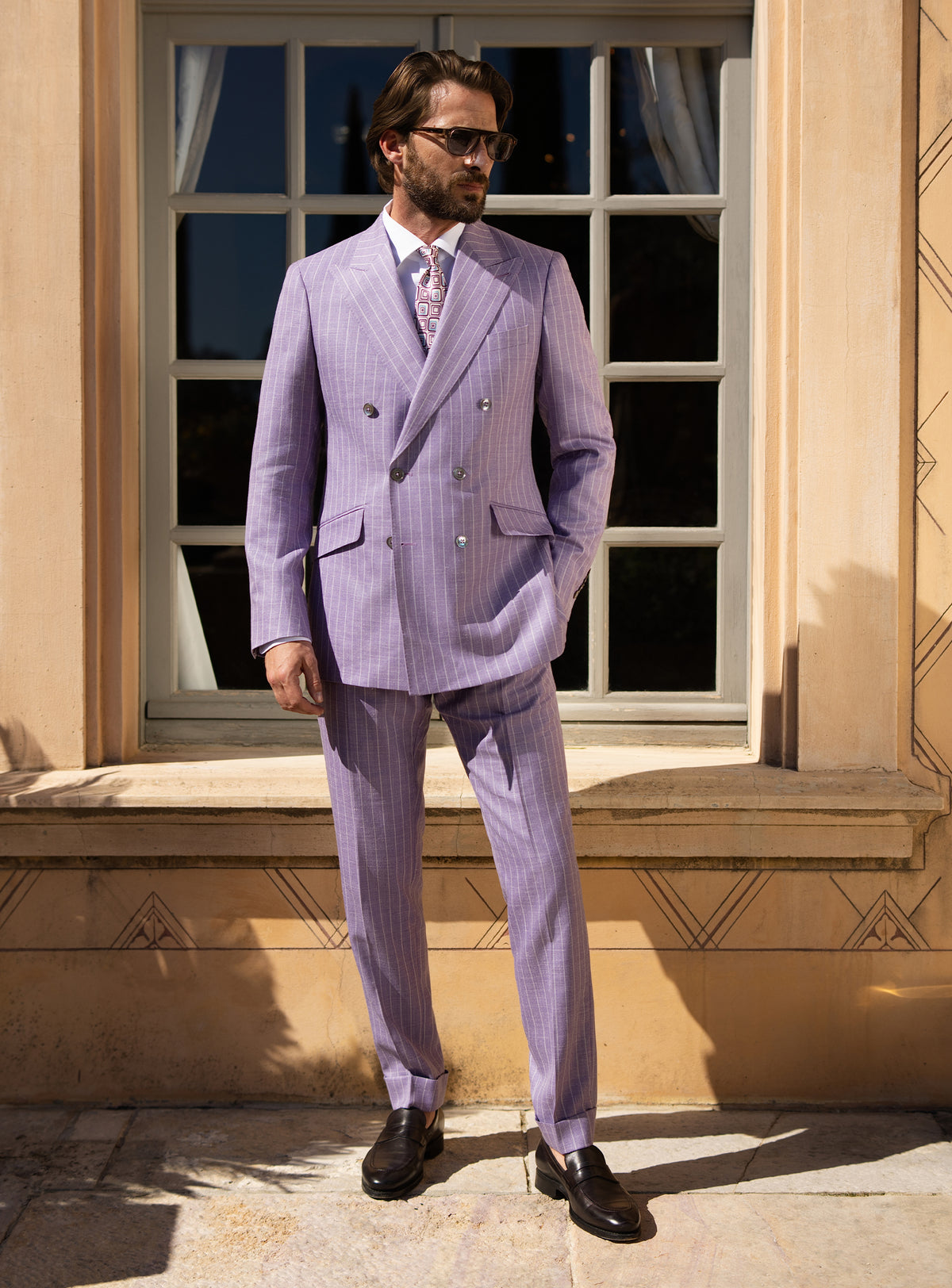 Lilac double-breasted Consiglieri suit worn with a white shirt