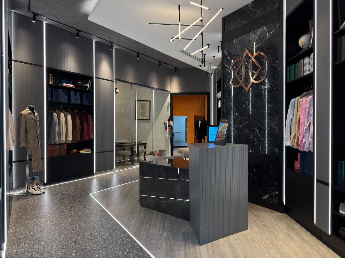 The monogrammed reception at Maison Consiglieri Constanța, a showroom for made-to-measure tailoring.