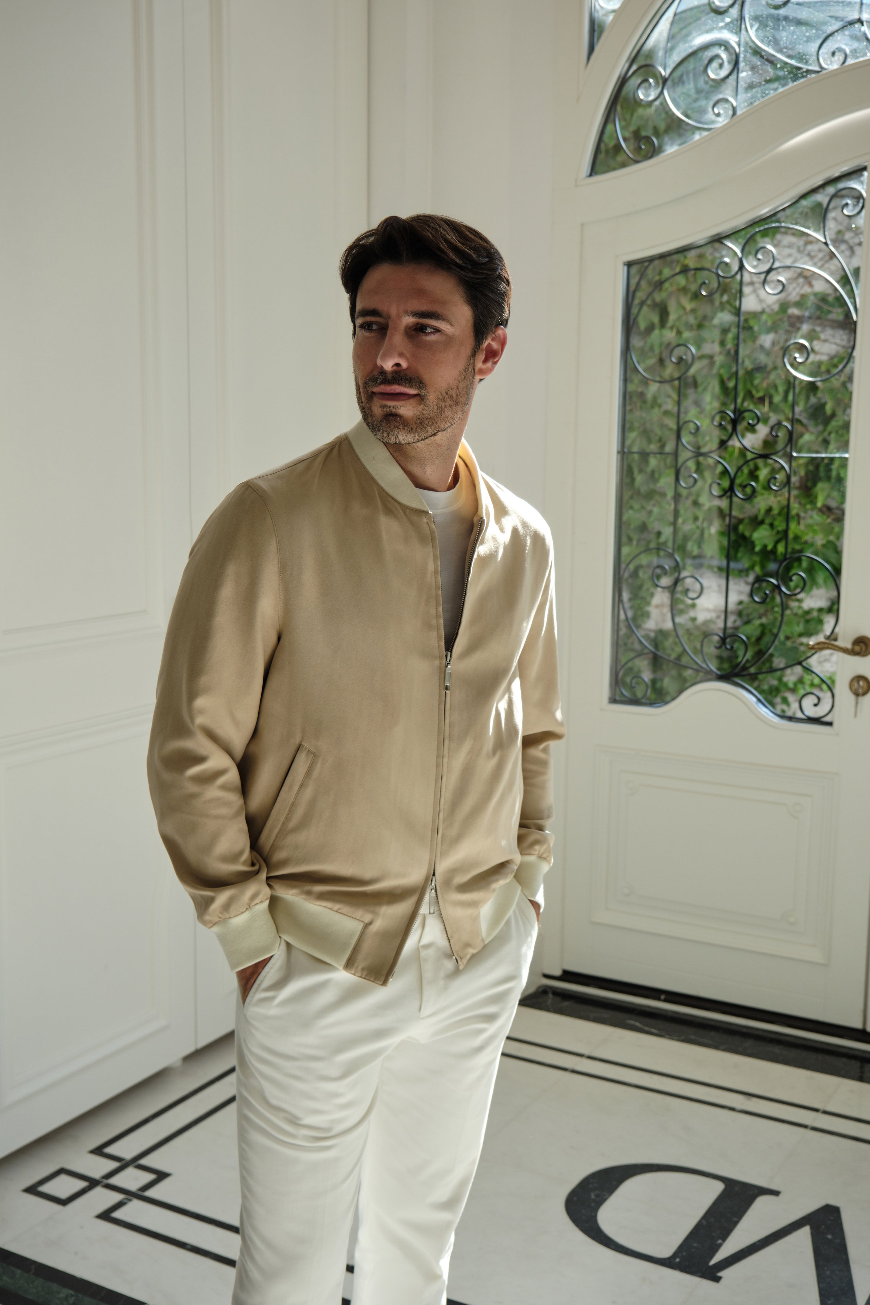 Sand Bomber jacket in a refined look in light tones, indoors