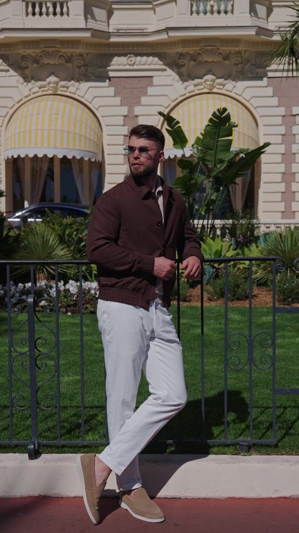Chocolate-brown Bomber jacket in a Mediterranean setting