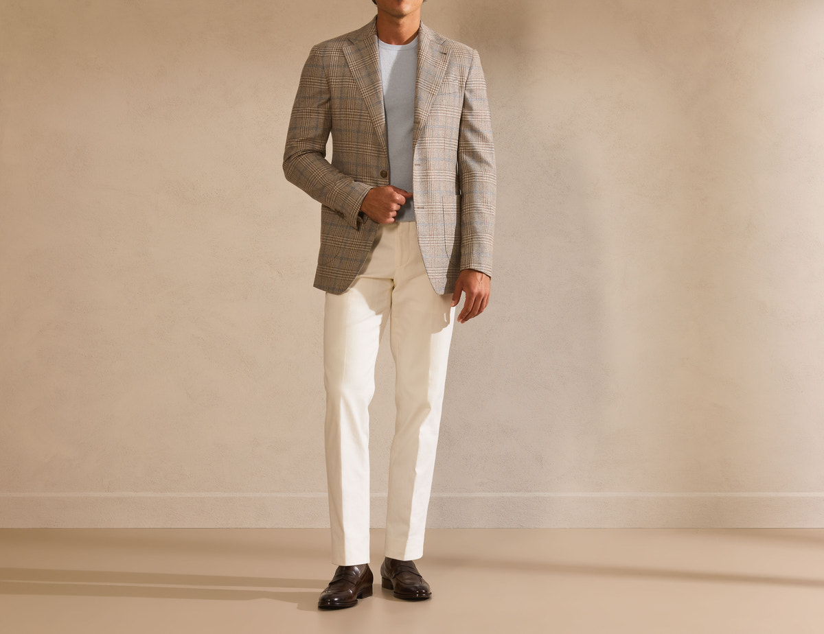 Greige Consiglieri blazer with a light sweater and white trousers