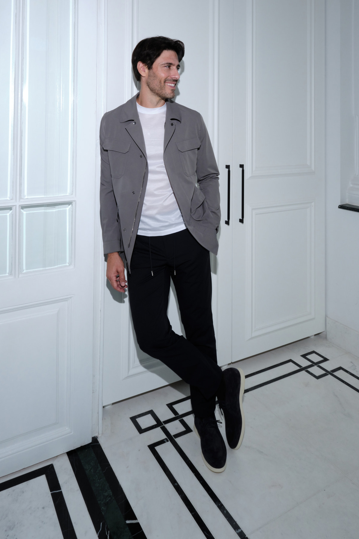 Grey Consiglieri patch-pocket jacket worn with black trousers