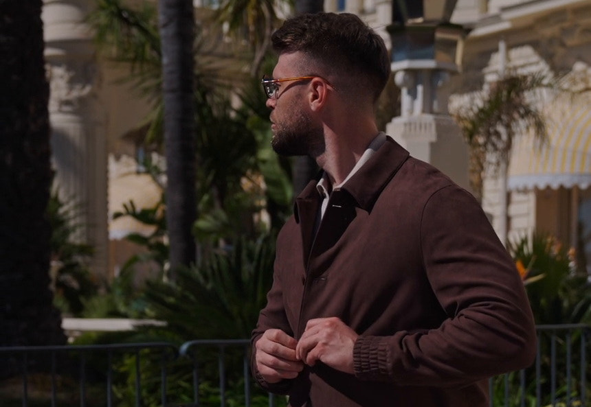 Burgundy Consiglieri jacket over a dark sweater in an urban setting