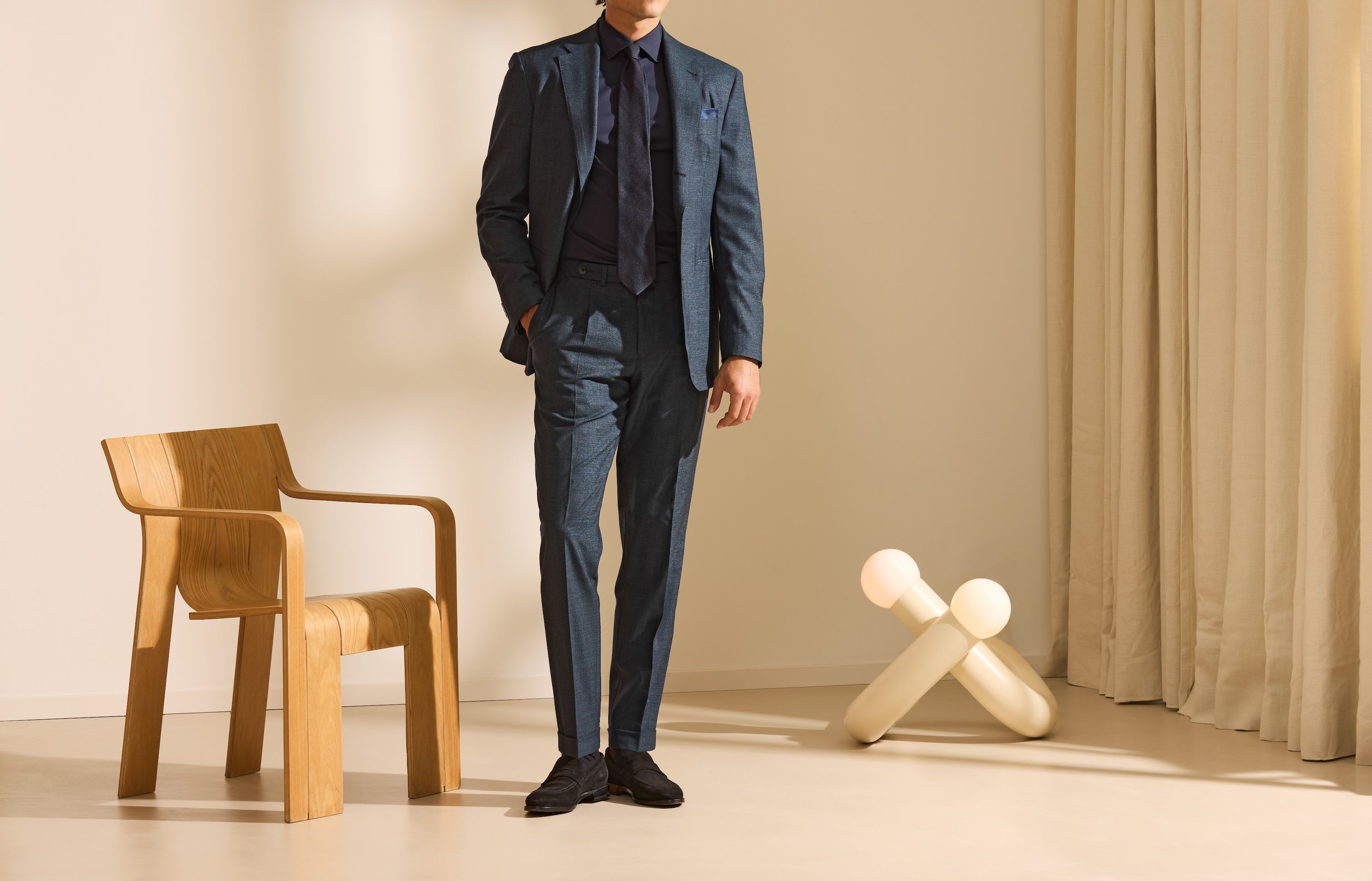 Contemporary tailoring with natural shoulders and easy proportions.