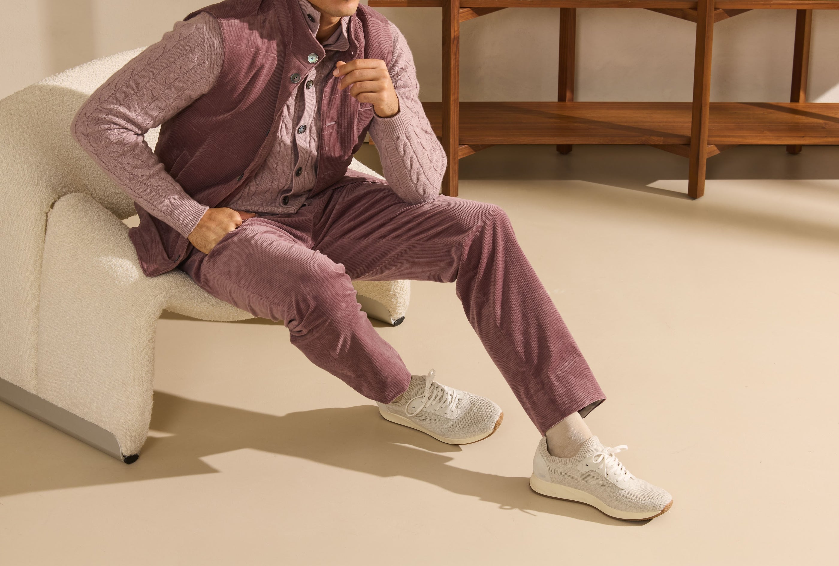 The Track Suit in burgundy with white runners — a note of colour in the Luxury Leisurewear register.