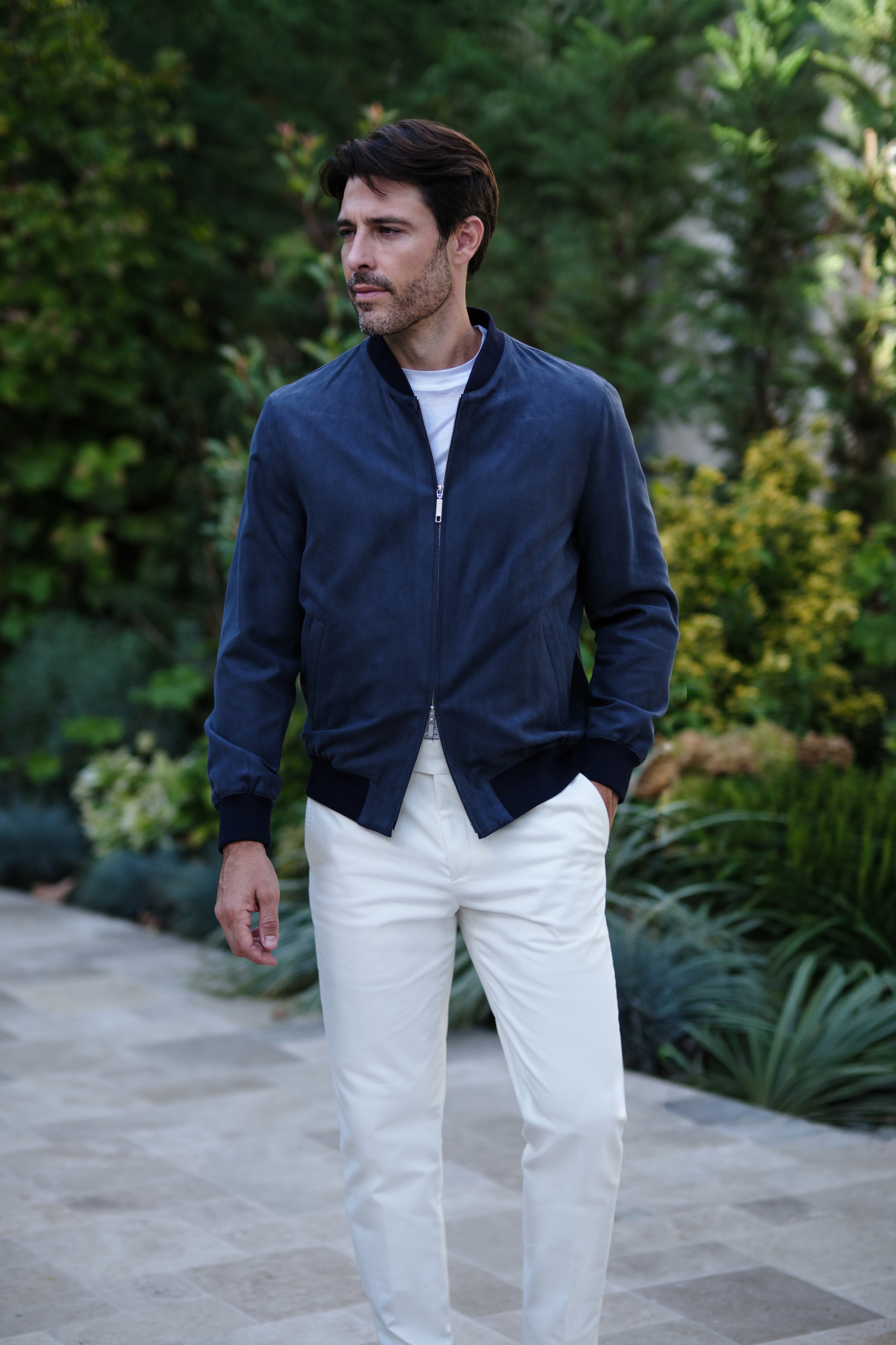 Complete Consiglieri look with a navy Bomber jacket and white trousers