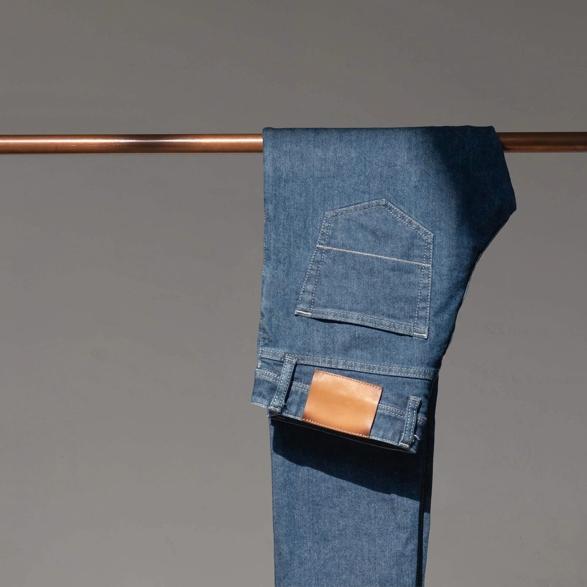 Mid-blue denim with light stitching — Custom Made Jeans detail.