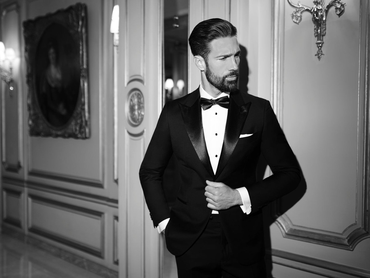 A black tuxedo with a waistcoat and bow tie in a Consiglieri formal look