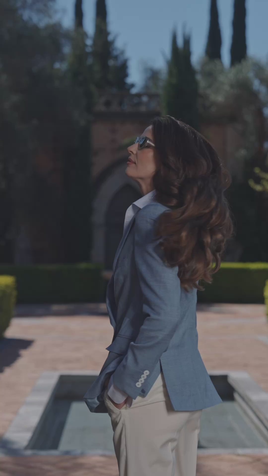 Blue Consiglieri Portofino Sky blazer with white trousers in a garden