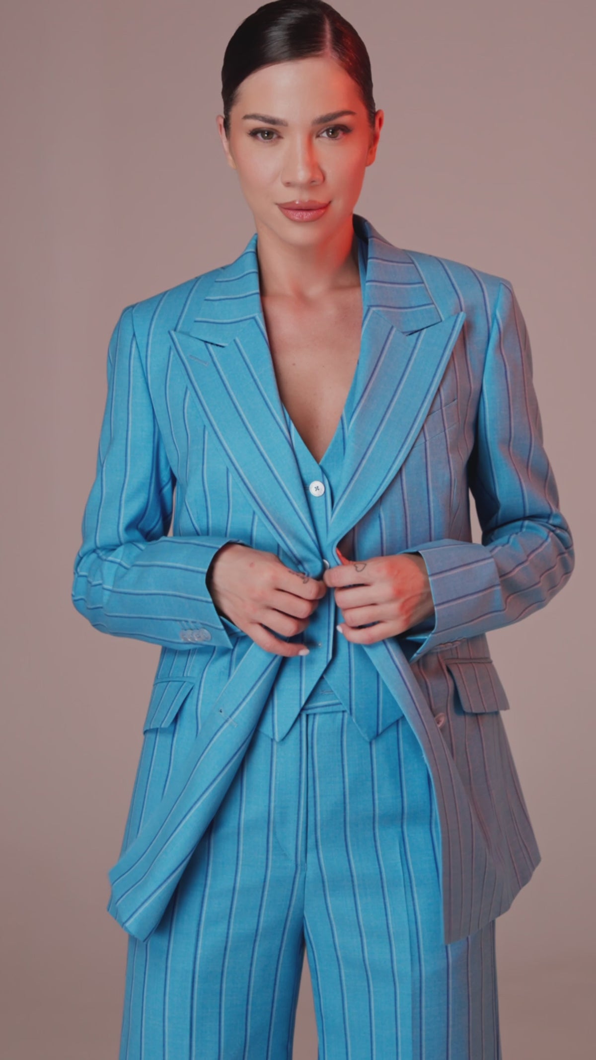 Women’s blue pinstripe suit with a fitted jacket