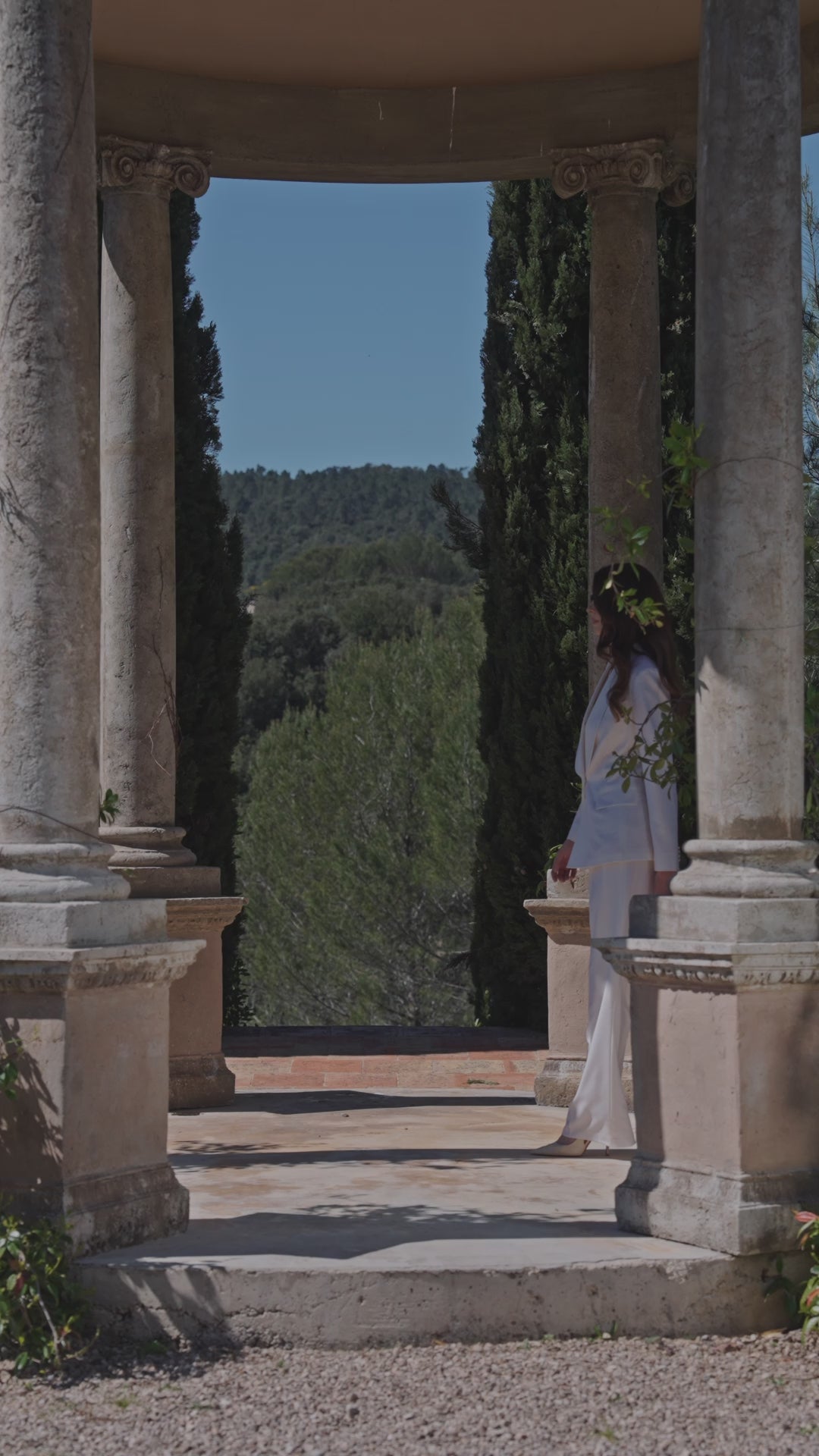 Ivory Consiglieri La Croisette women's suit in a columned pavilion
