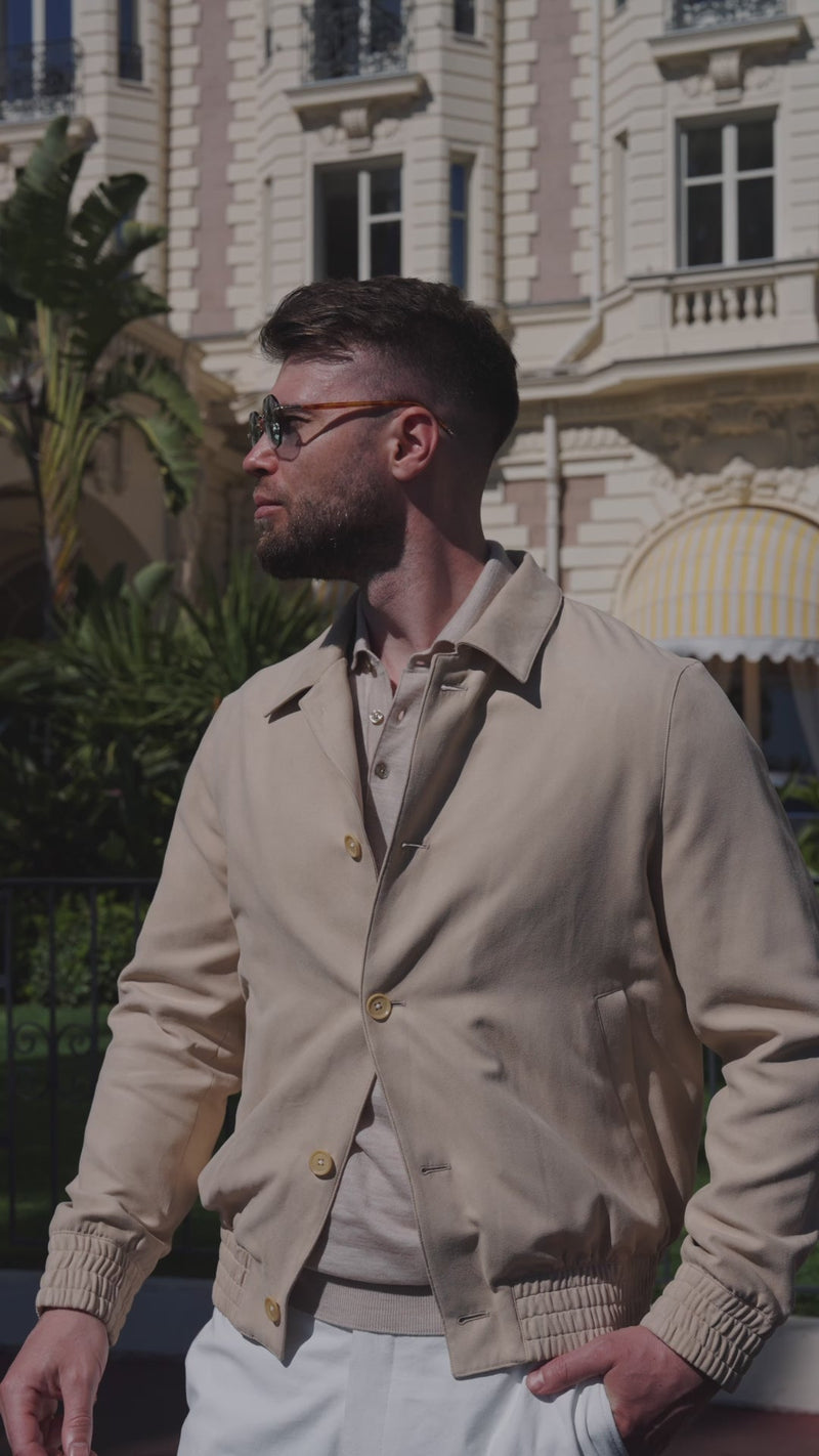 A beige-toned bomber jacket styled in an urban Consiglieri look