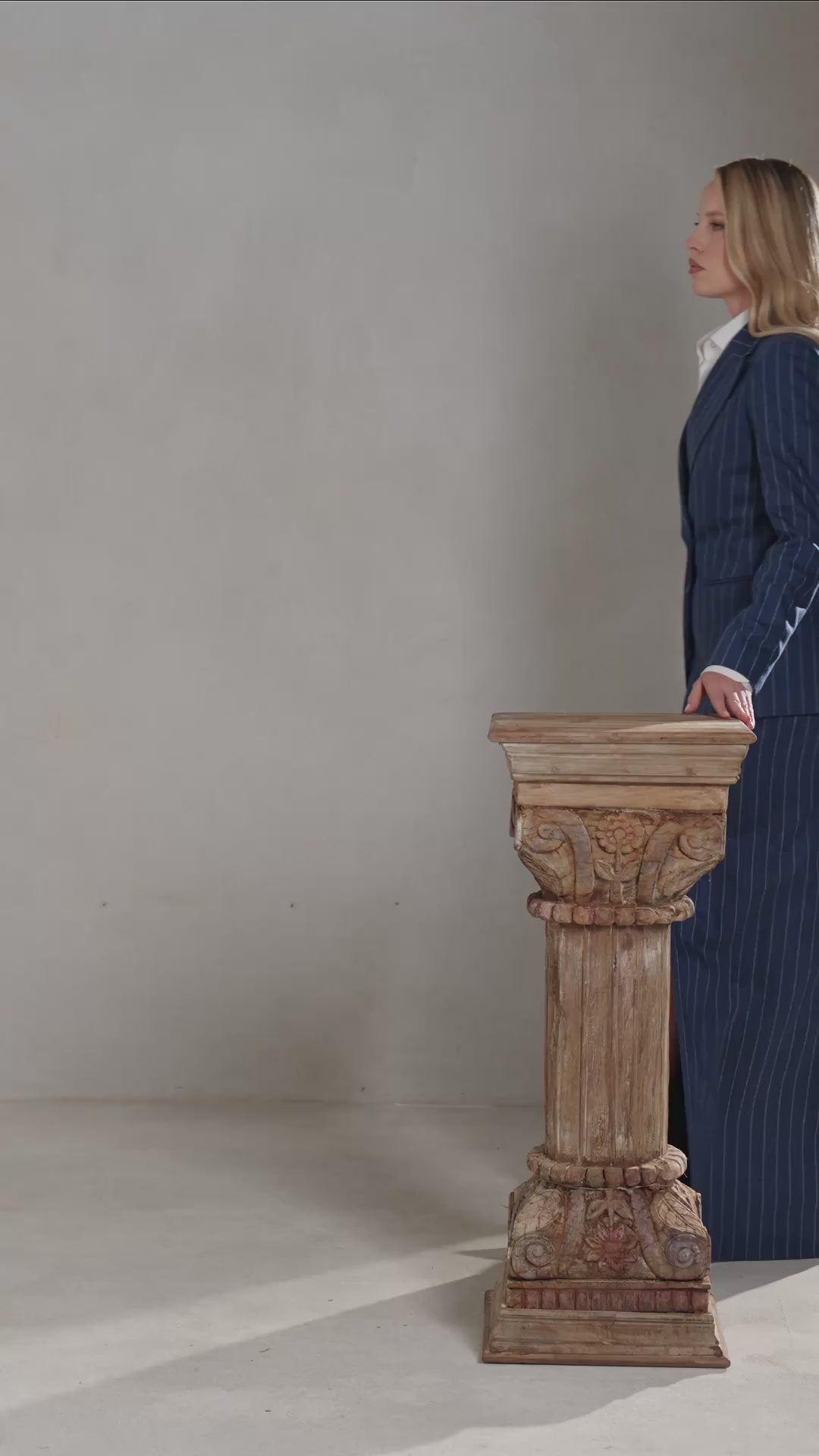 A DONNA pinstripe suit with a double-breasted blazer and long skirt, from The Mayfair Edit.