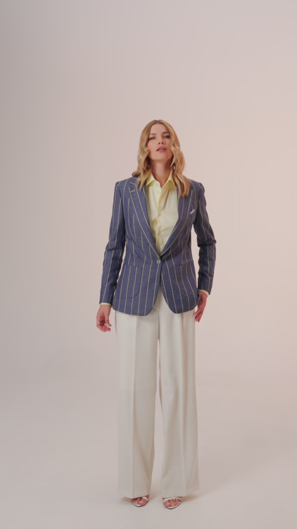 Women’s navy striped jacket with wide-leg white trousers