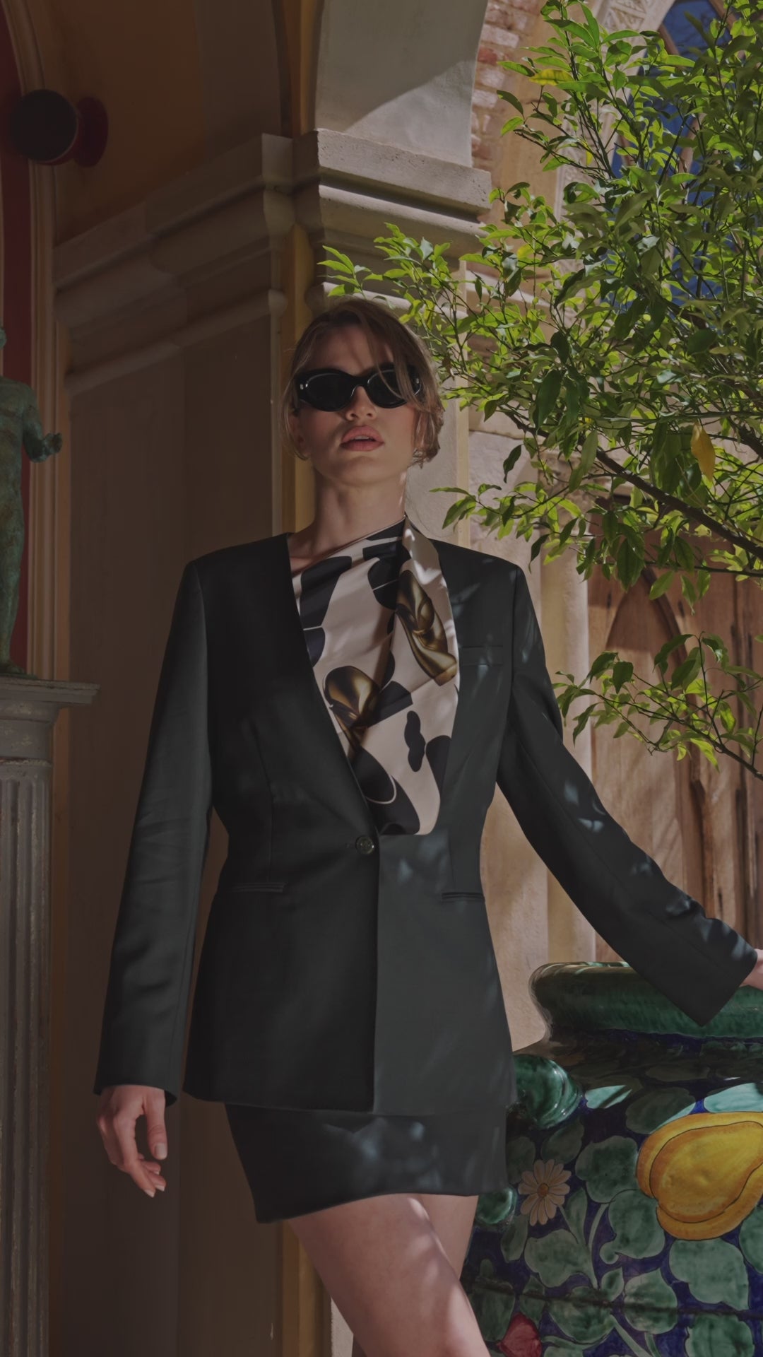 Consiglieri Ravello women's suit with a dark green blazer, short skirt and printed scarf
