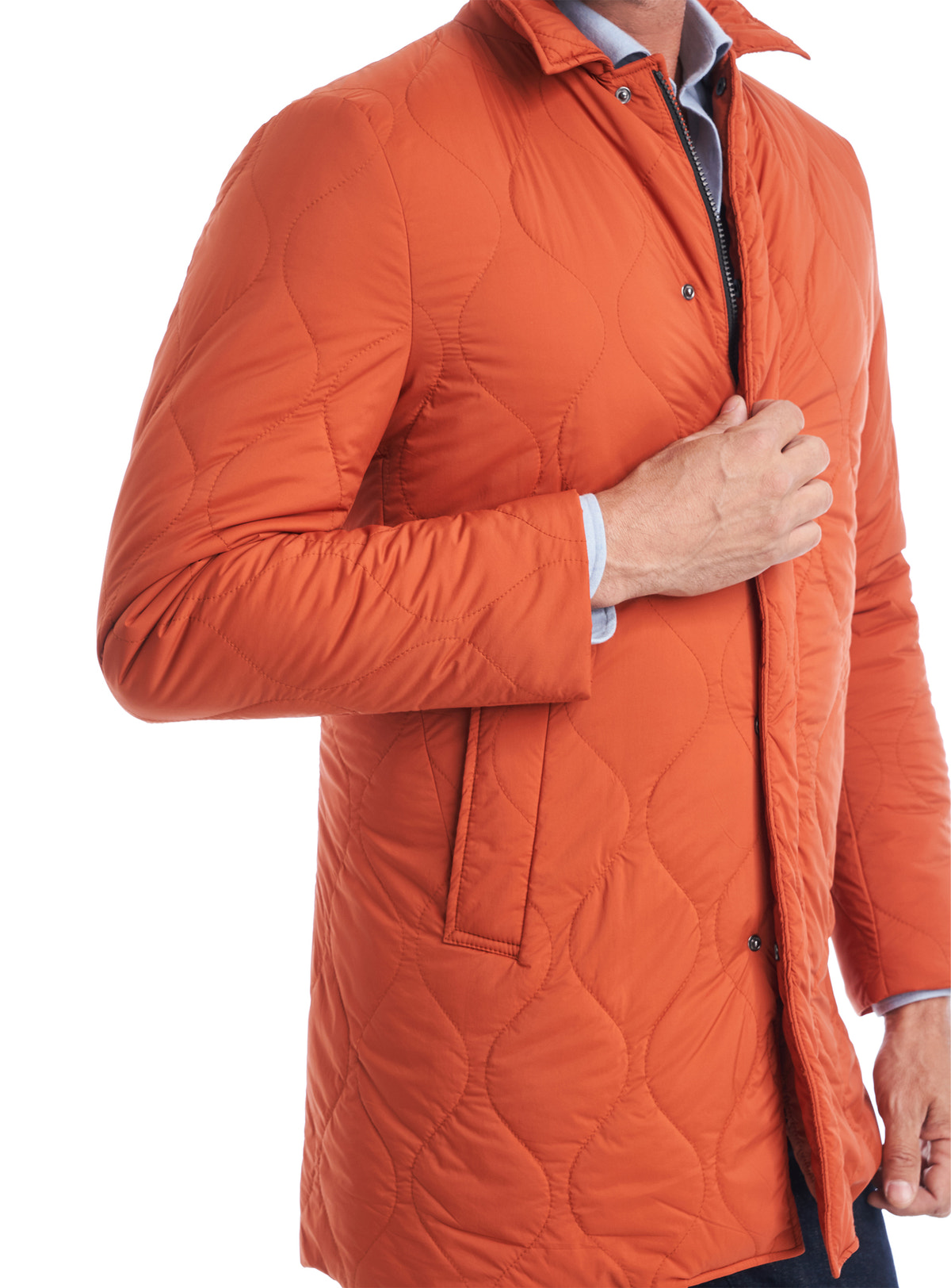 Consiglieri Bassel: quilting and angled pocket of the orange jacket