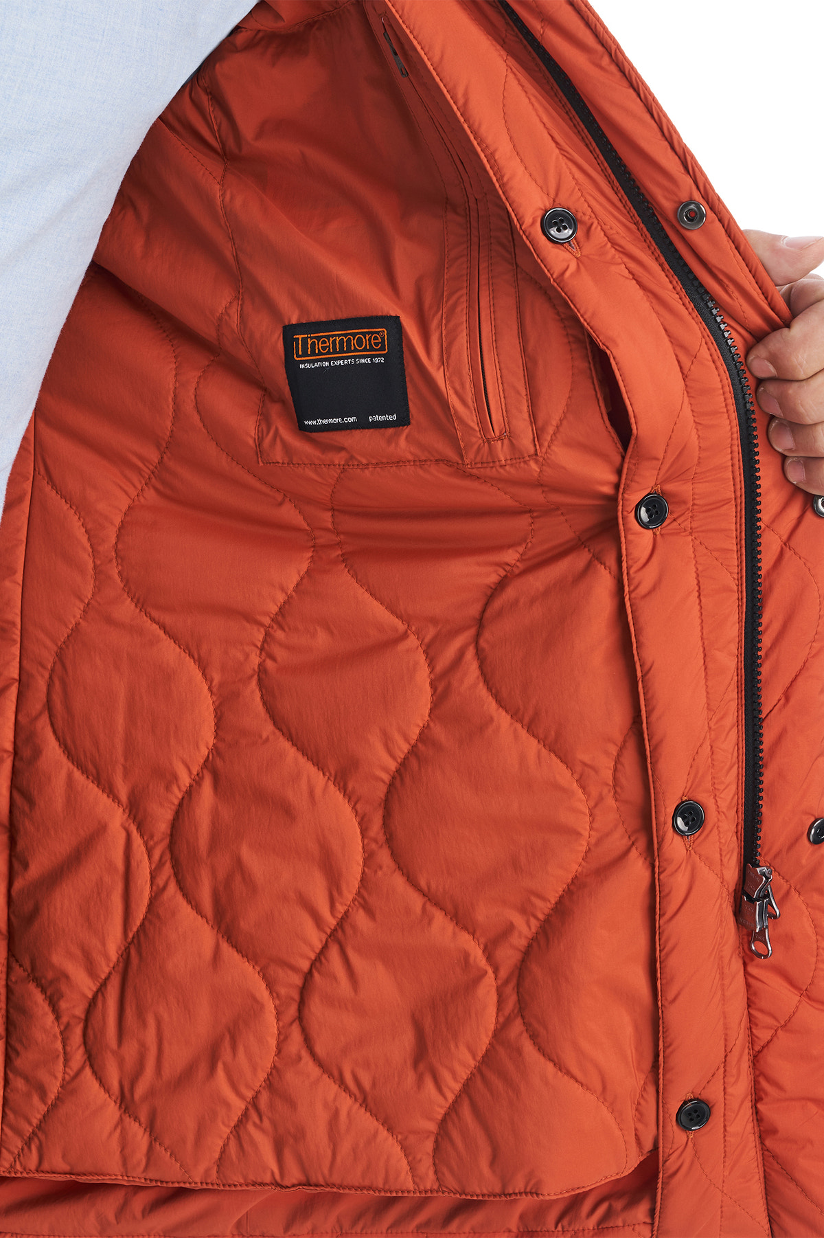 Consiglieri Bassel: orange quilted jacket lining