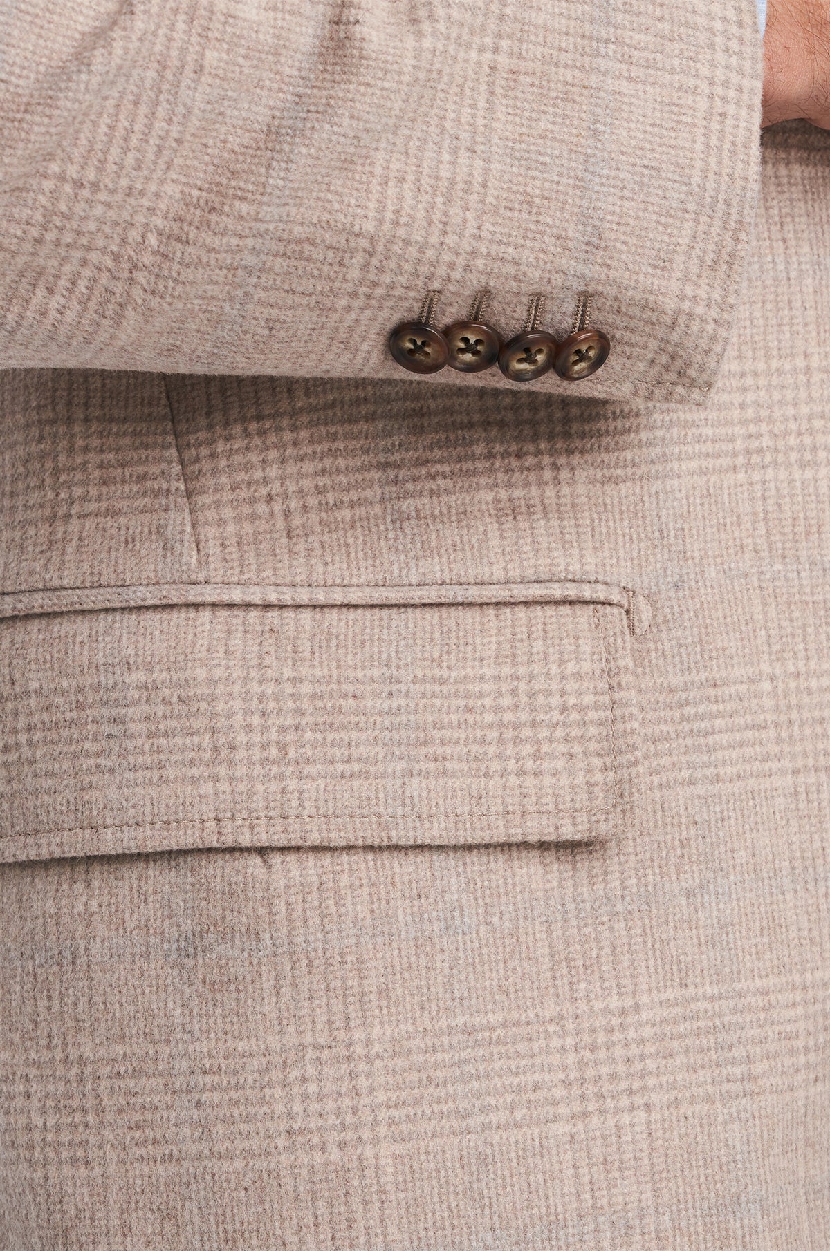 Consiglieri Cannes: buttoned cuff and subtle texture of the taupe overcoat