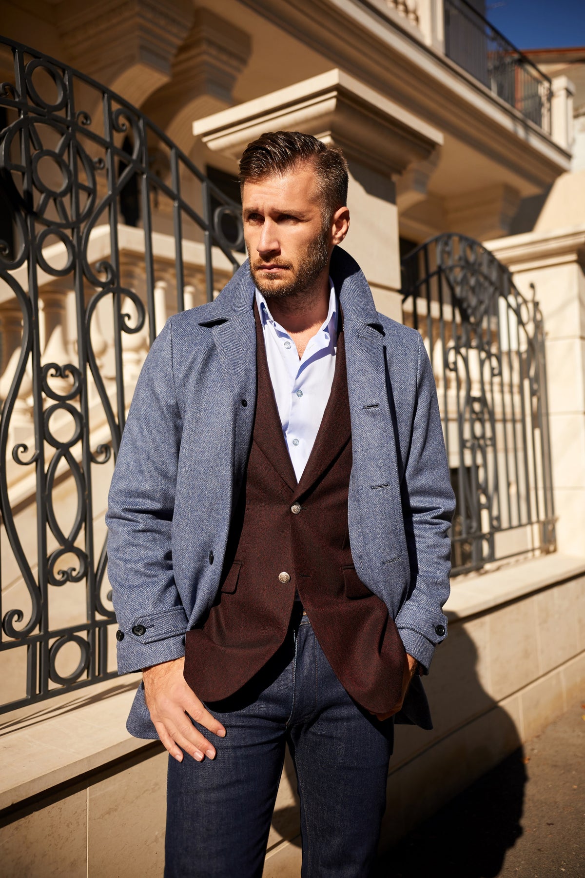 Consiglieri Milano: blue-grey overcoat over a burgundy jacket