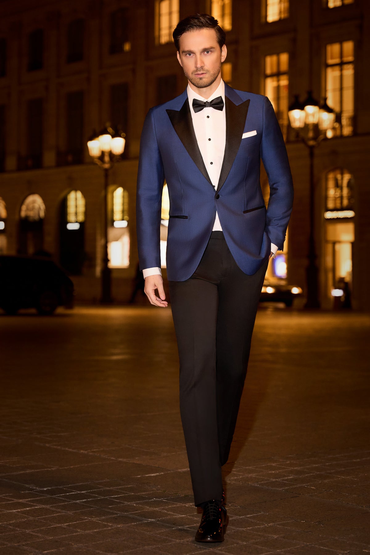 Consiglieri: rich blue tuxedo jacket with black lapels and black trousers