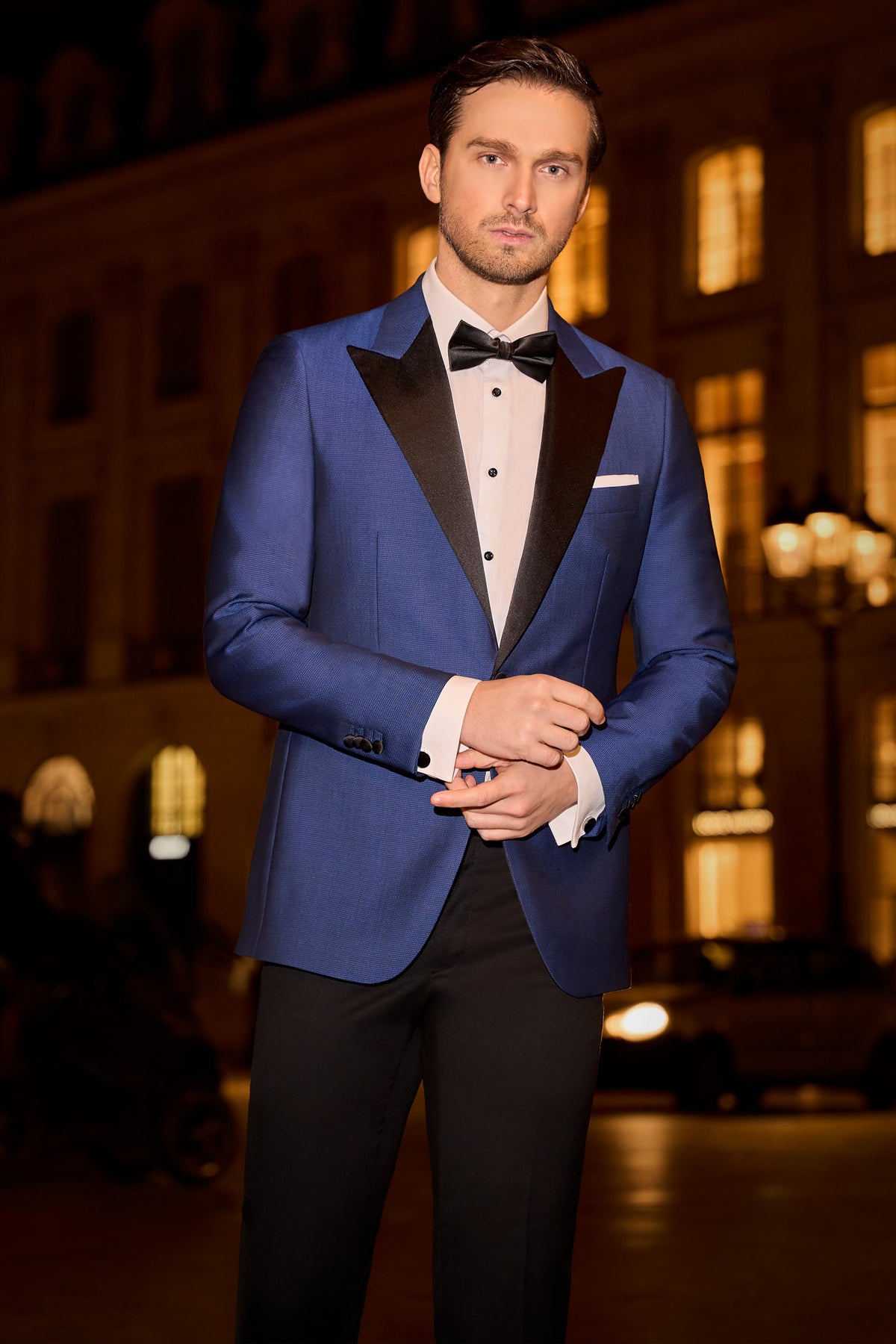 Consiglieri: rich blue tuxedo jacket with black lapels and black trousers
