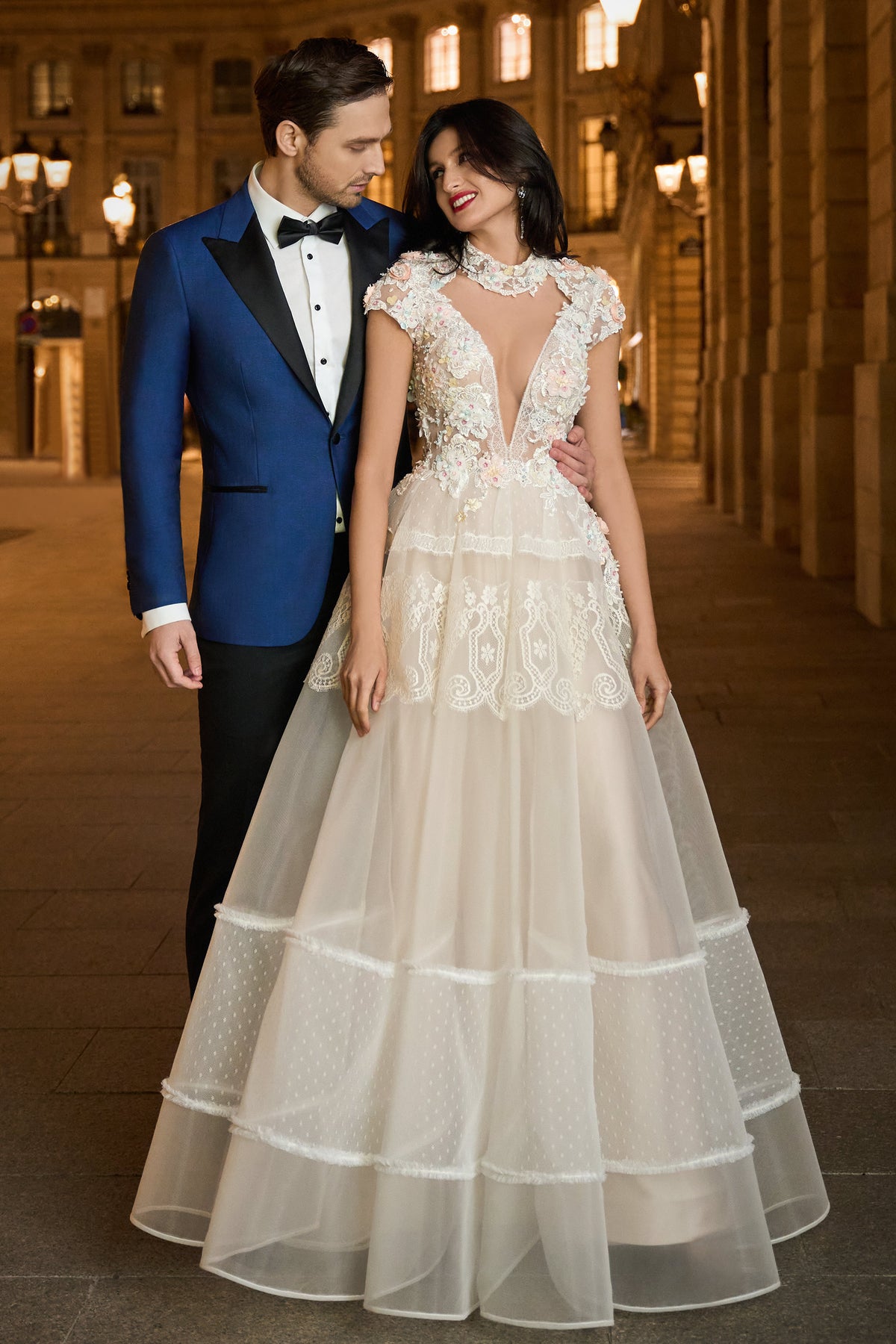 Consiglieri: blue tuxedo with black lapels beside a bridal gown