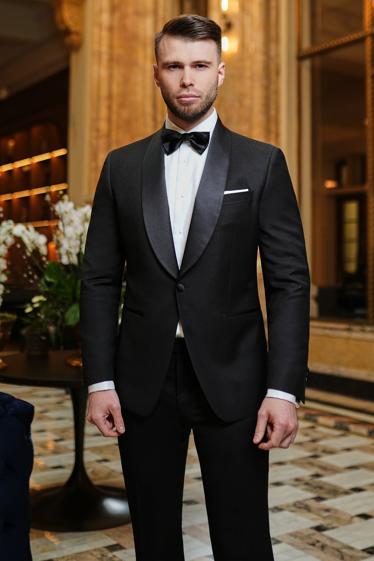 Consiglieri: black tuxedo with a lustrous shawl collar and black bow tie