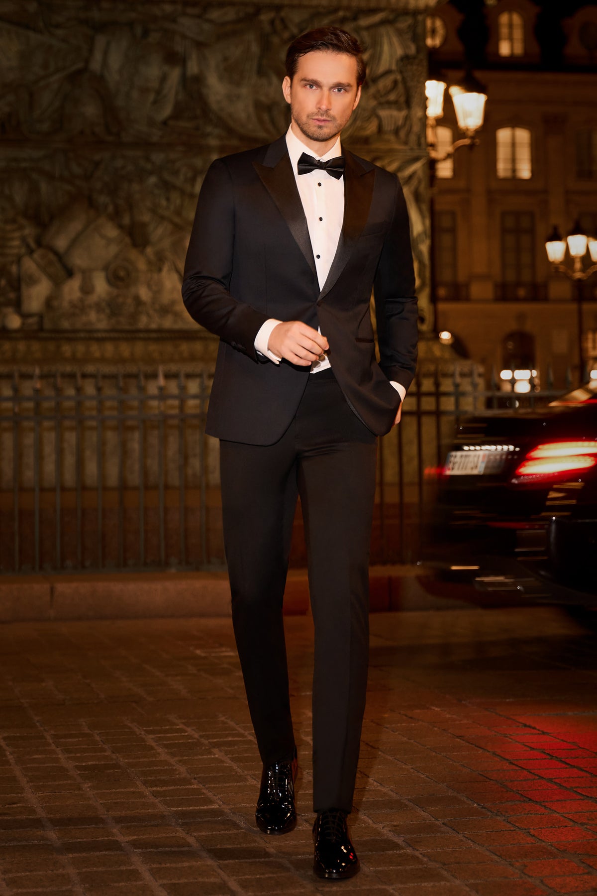 Consiglieri: black tuxedo with contrasting lapels and a bow tie in an evening setting