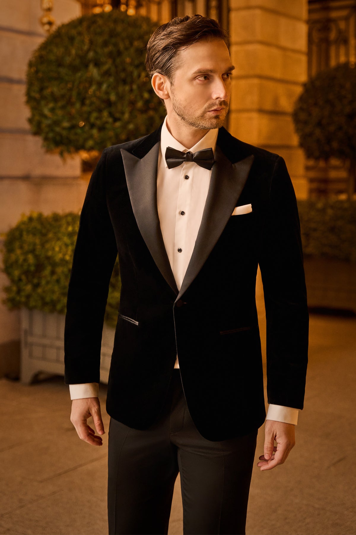 Consiglieri: black tuxedo jacket with lustrous lapels and a black bow tie