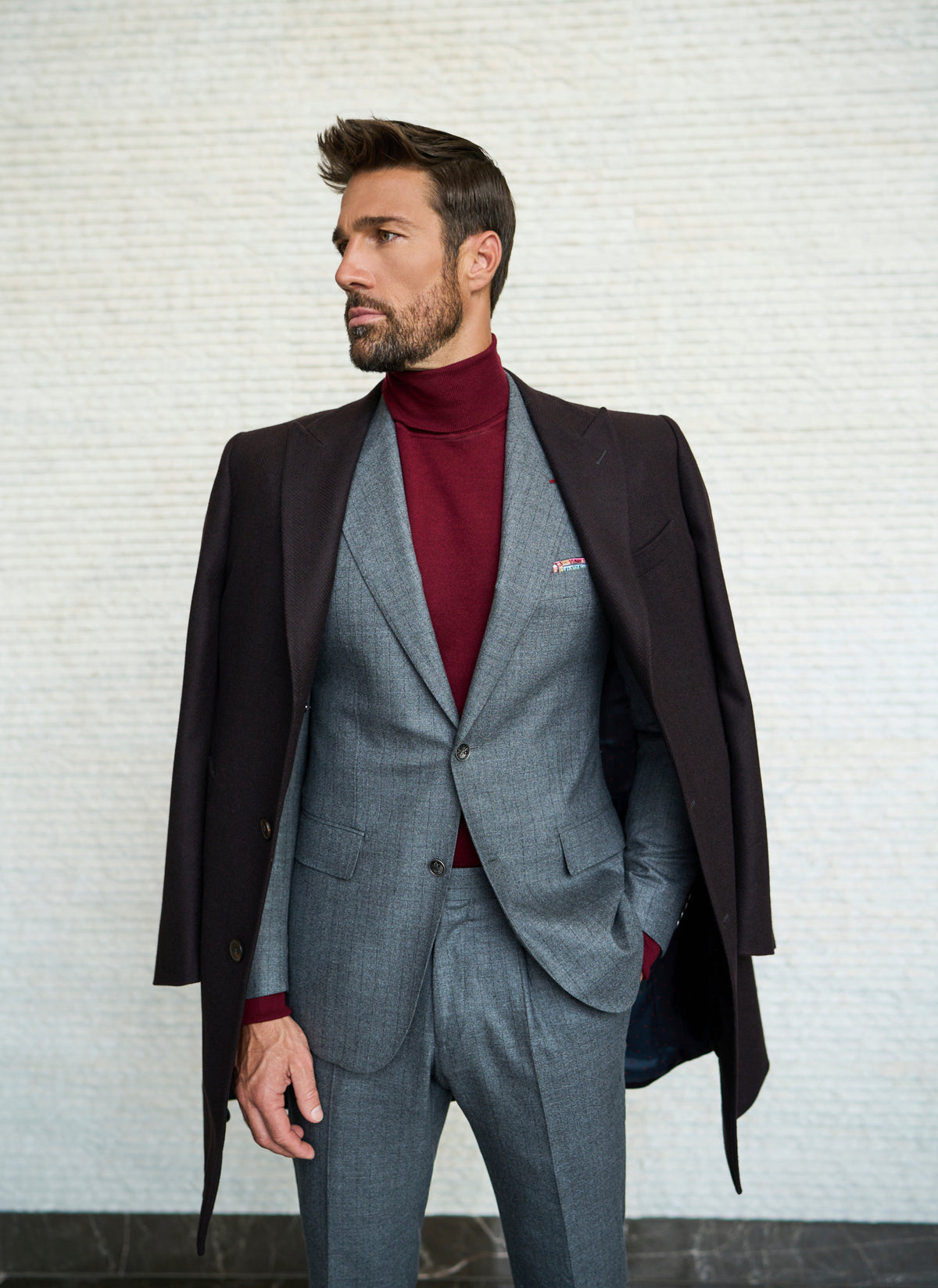 Consiglieri Meribel: deep brown overcoat with a grey suit and burgundy roll-neck