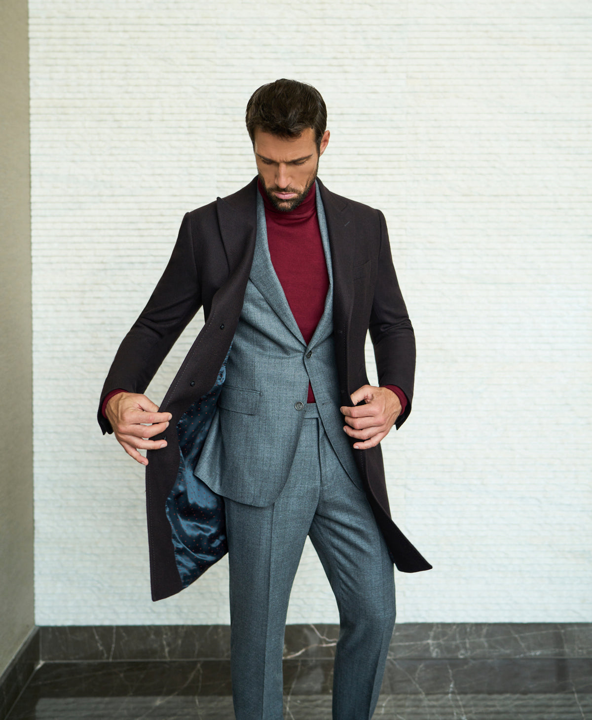 Consiglieri Meribel: deep brown overcoat with a grey suit and burgundy roll-neck