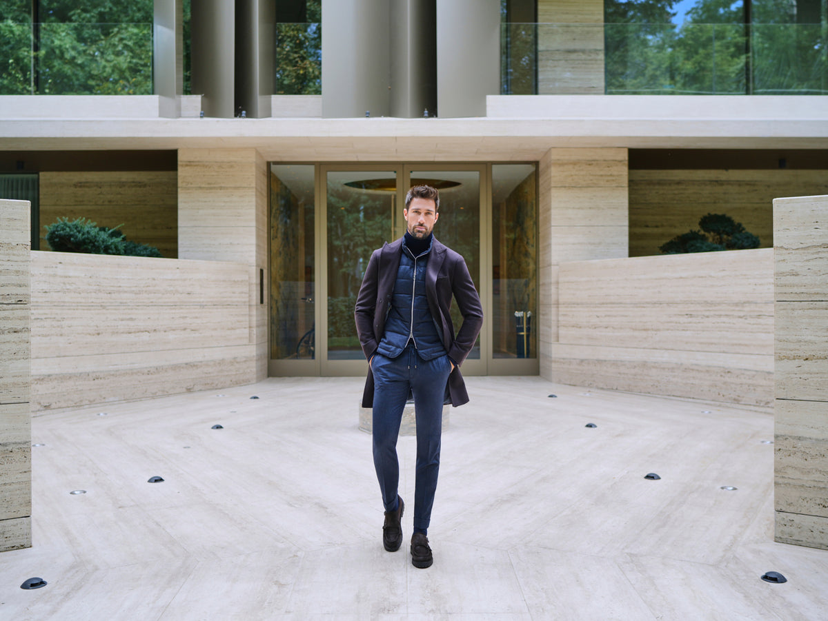 Consiglieri Davos: deep burgundy overcoat with a navy scarf and blue trousers