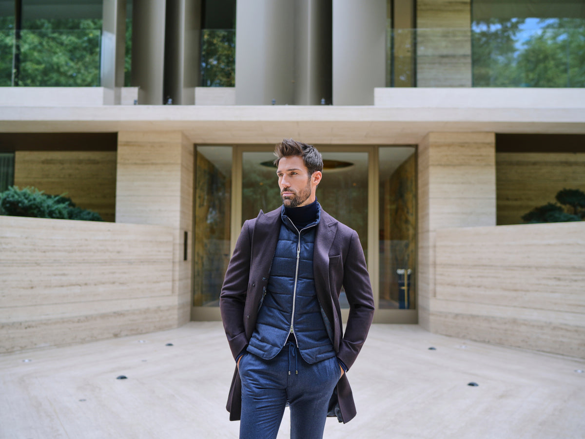 Consiglieri Davos: deep burgundy overcoat with a navy scarf and blue trousers