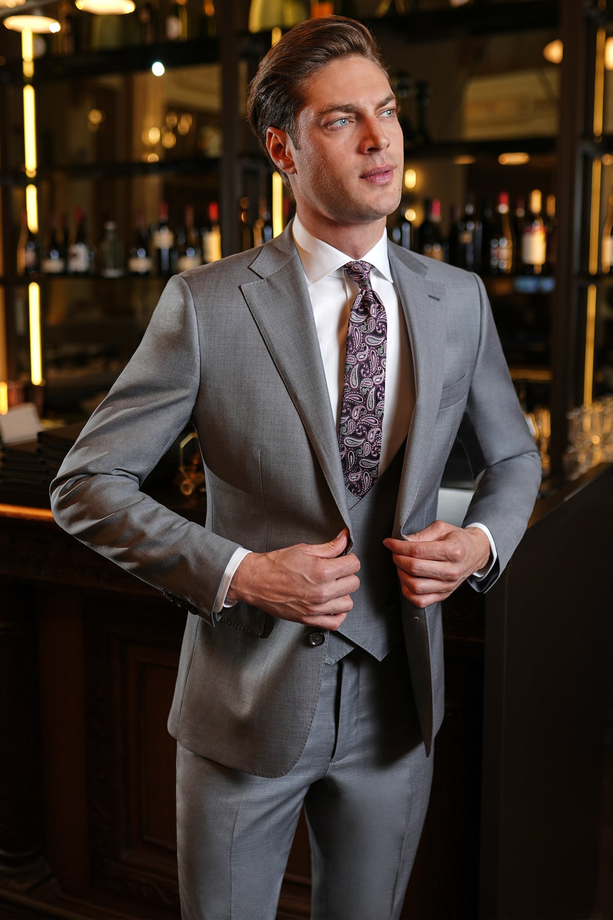 Consiglieri Hanover: grey three-piece suit with a white shirt and patterned tie