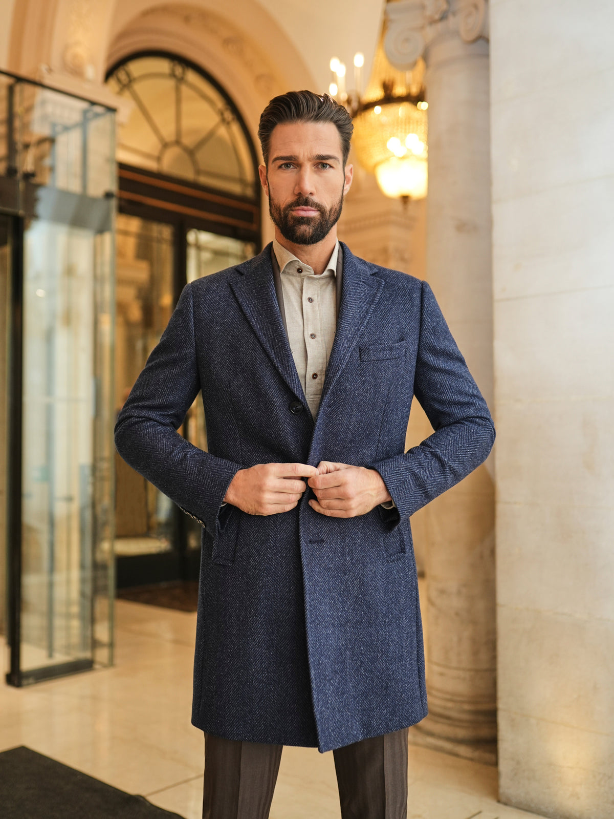 Consiglieri Zermatt: navy textured overcoat styled with brown trousers