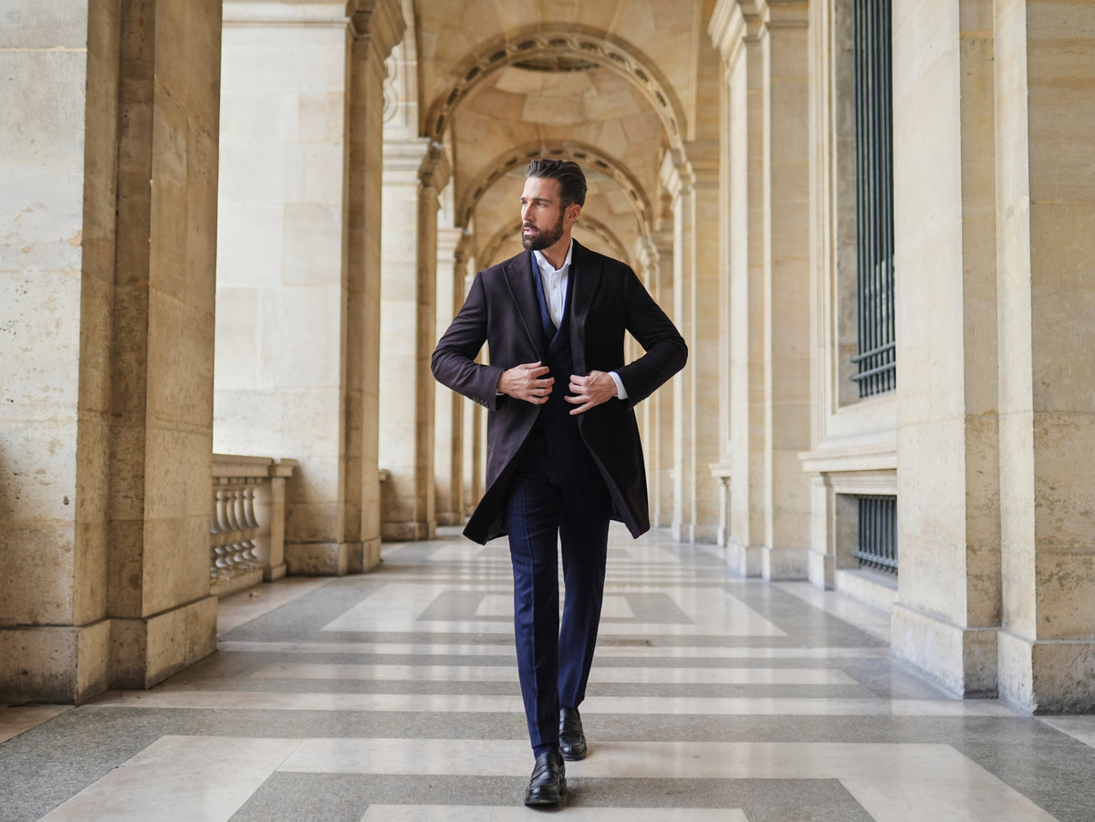 Consiglieri Meribel: dark overcoat worn over a navy suit