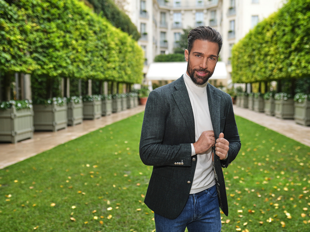 Consiglieri: ivory roll-neck beneath a dark jacket
