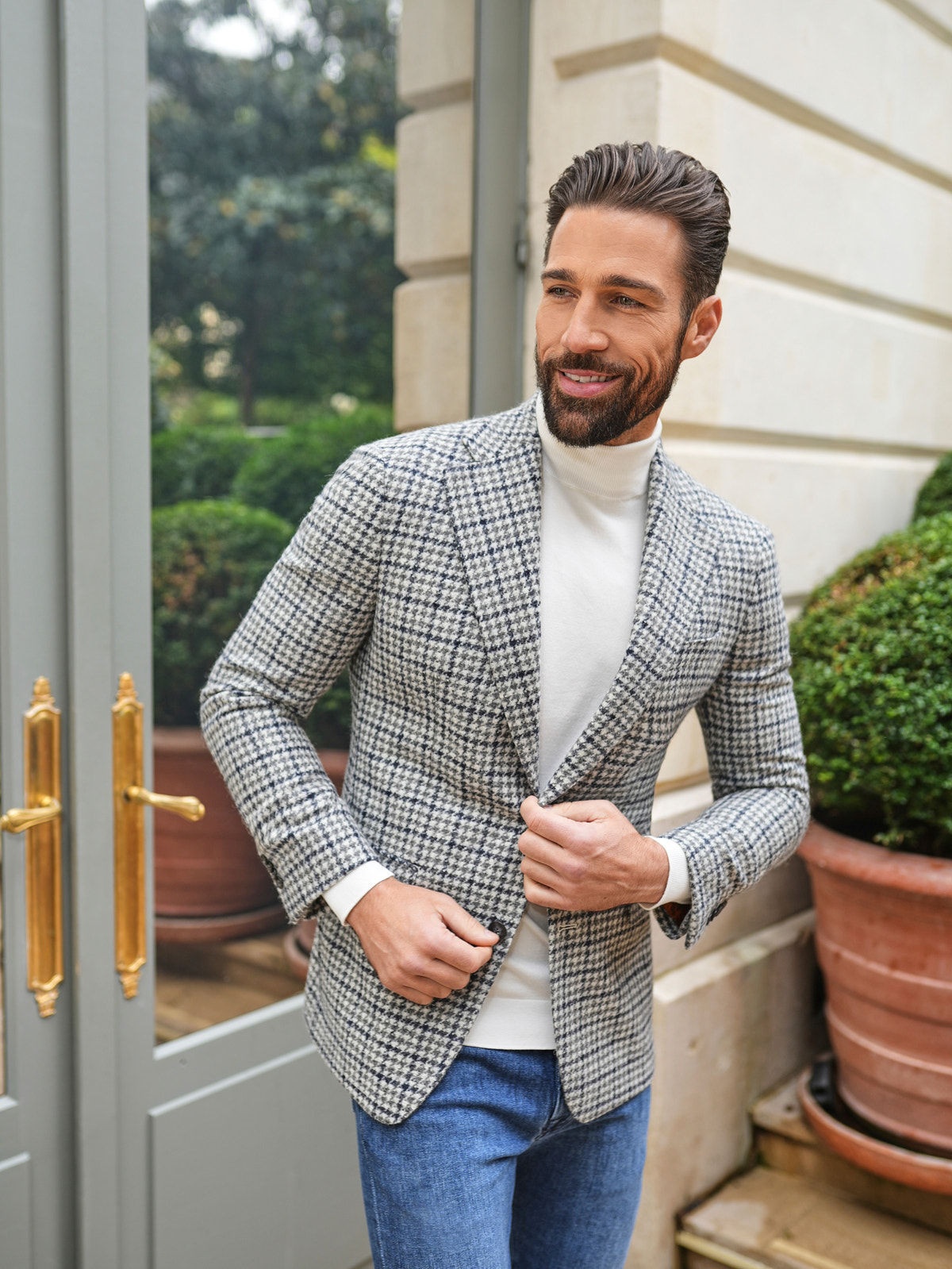 Consiglieri: ivory roll-neck beneath a grey checked jacket