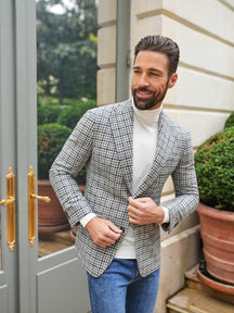 Consiglieri: ivory roll-neck beneath a grey checked jacket