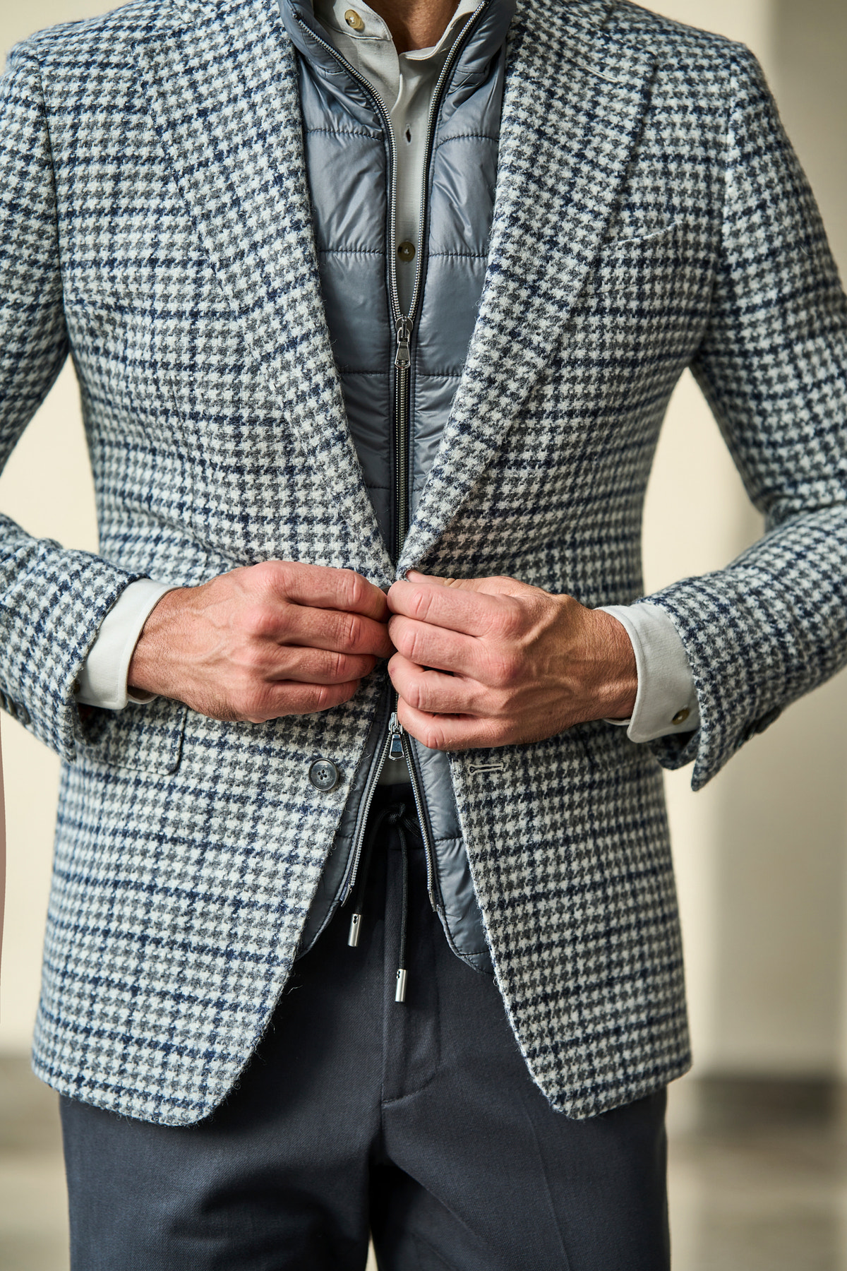 Consiglieri: grey gilet quilting and the jacket's subtle checks