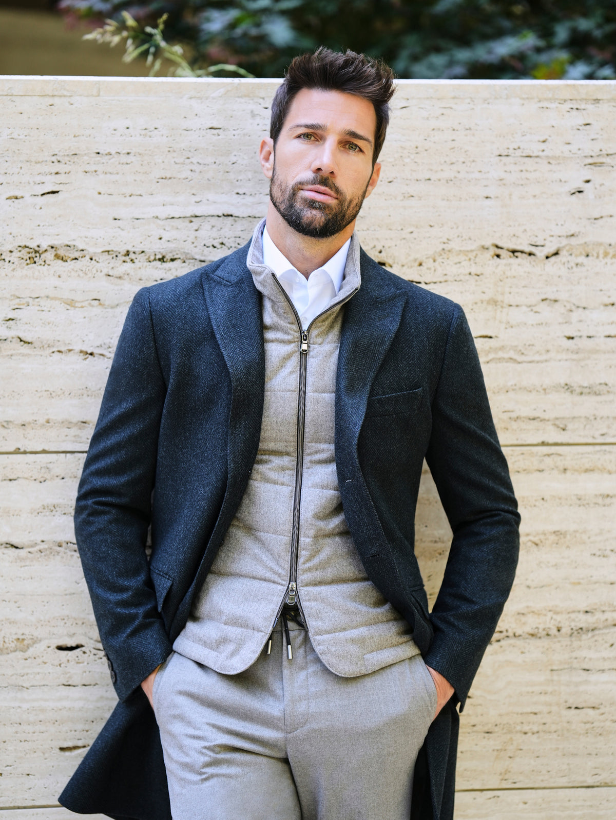 Consiglieri Val d'Isere: dark green overcoat with a quilted gilet and light trousers