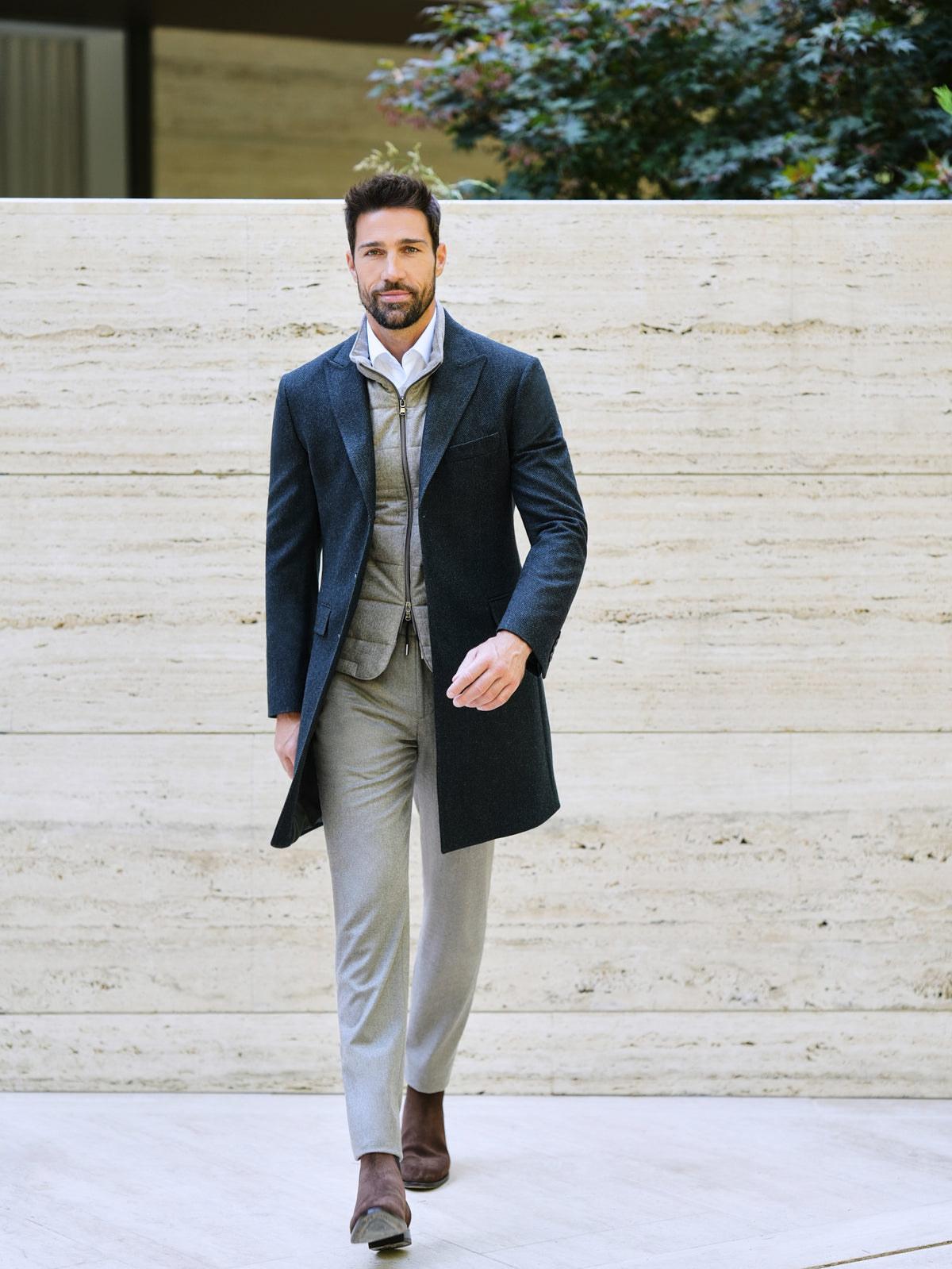 Consiglieri Val d'Isere: dark green overcoat with a quilted gilet and light trousers