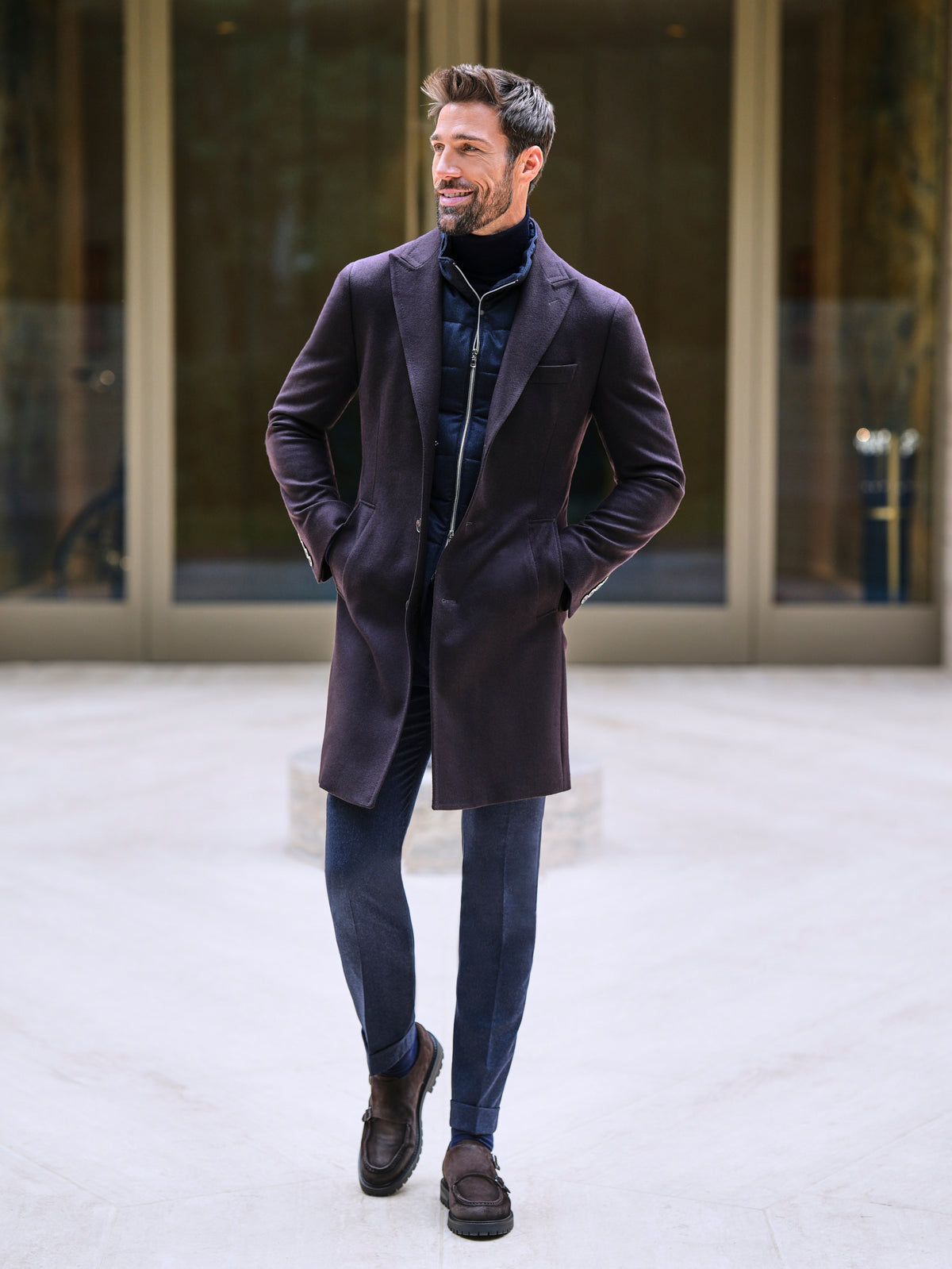 Consiglieri Davos: deep burgundy overcoat with a navy scarf and blue trousers