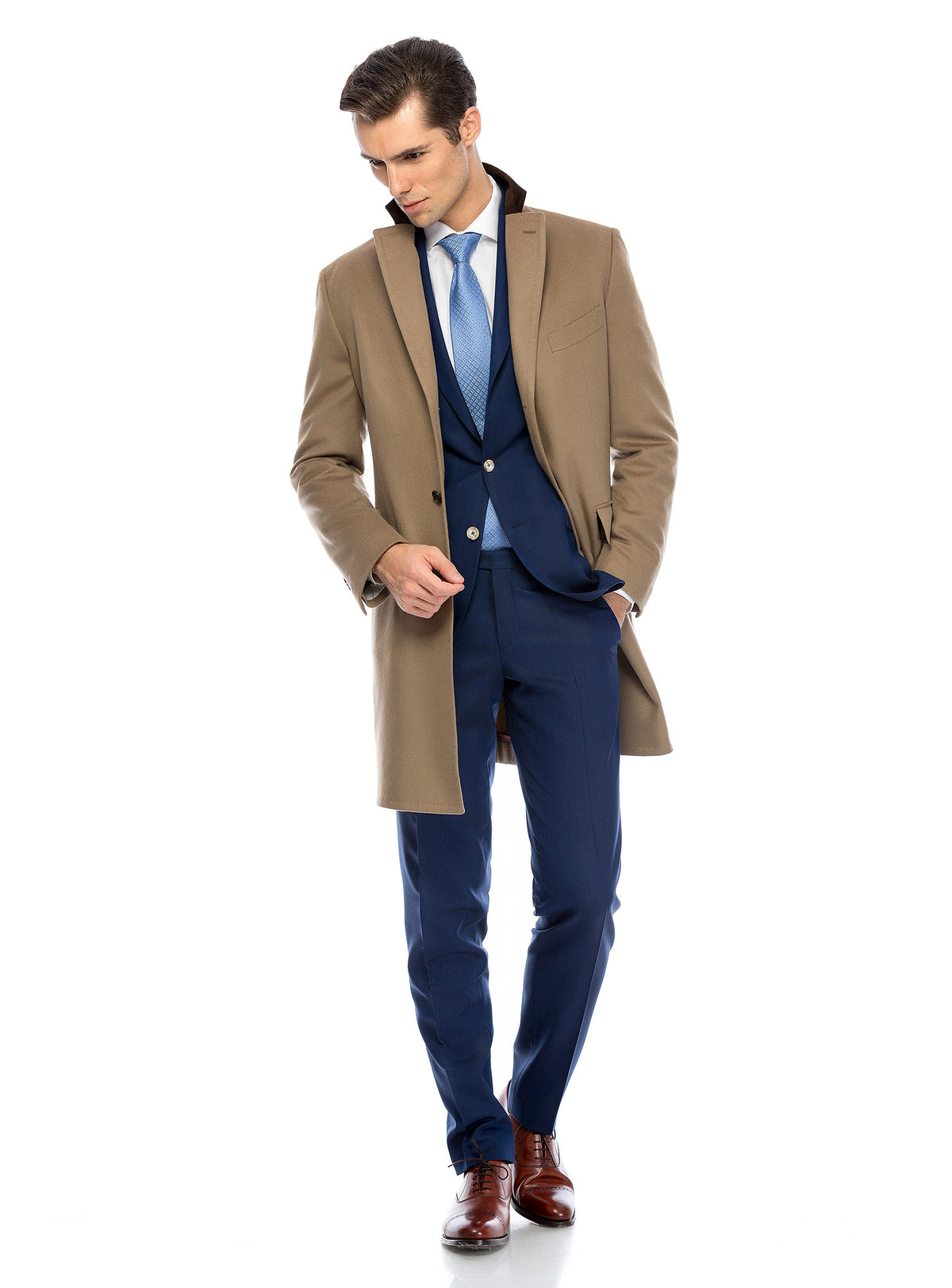 Consiglieri Mayfair: camel overcoat over a blue three-piece suit